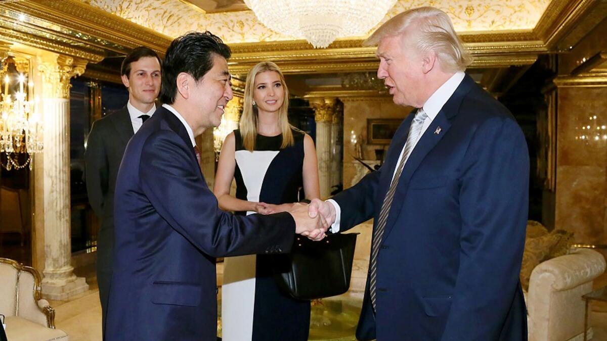 Japanese Prime Minister Shinzo Abe being welcomed by President-elect Donald Trump beside Ivanka Trump and her husband Jared Kushner in New York on November 17.