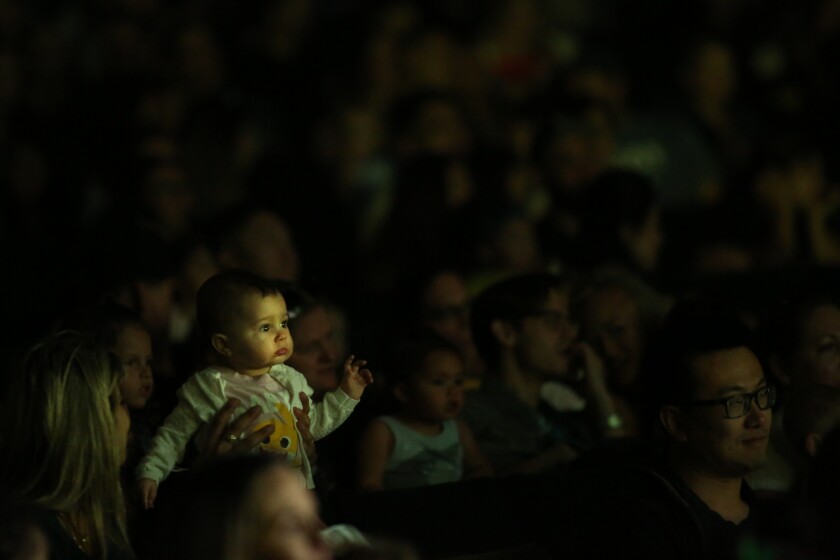 A baby watches “Baby Shark Live!” in Long Beach
