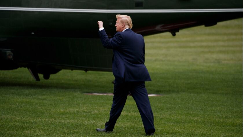 President Trump walks to board Marine One in Washington on May 8.