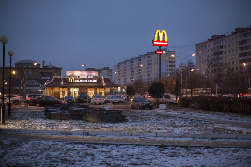 FILE - McDonald's restaurant is seen in the center of Dmitrov, a Russian town 75 km., (47 miles) north from Moscow, Russia, on Dec. 6, 2014. McDonald’s says it's started the process of selling its Russian business, which includes 850 restaurants that employ 62,000 people. The fast food giant pointed to the humanitarian crisis caused by the war, saying holding on to its business in Russia “is no longer tenable, nor is it consistent with McDonald’s values.” The Chicago-based company had temporarily closed its stores in Russia but was still paying employees. (AP Photo/FILE)