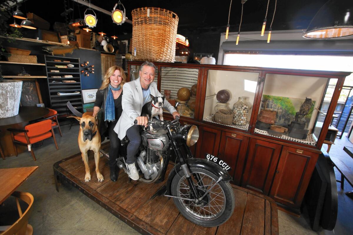 Owners Kristine and Shane Brown of Big Daddy’s in Culver City on a 1948 Norton bike.