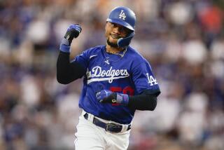 Los Angeles Dodgers' Mookie Betts runs the bases after hitting a home run against the Miami Marlins.