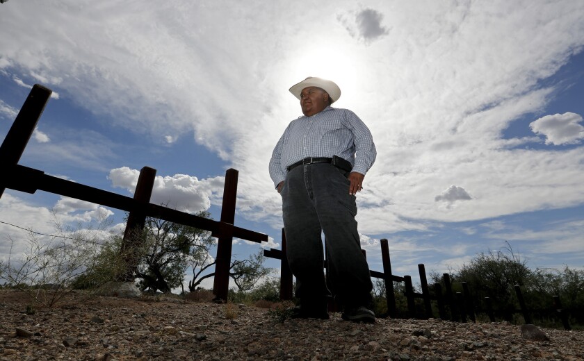 Verlon Jose, vice chairman of the Tohono O'odham Nation, stands near a vehicle barrier along the reservation's border with Mexico.