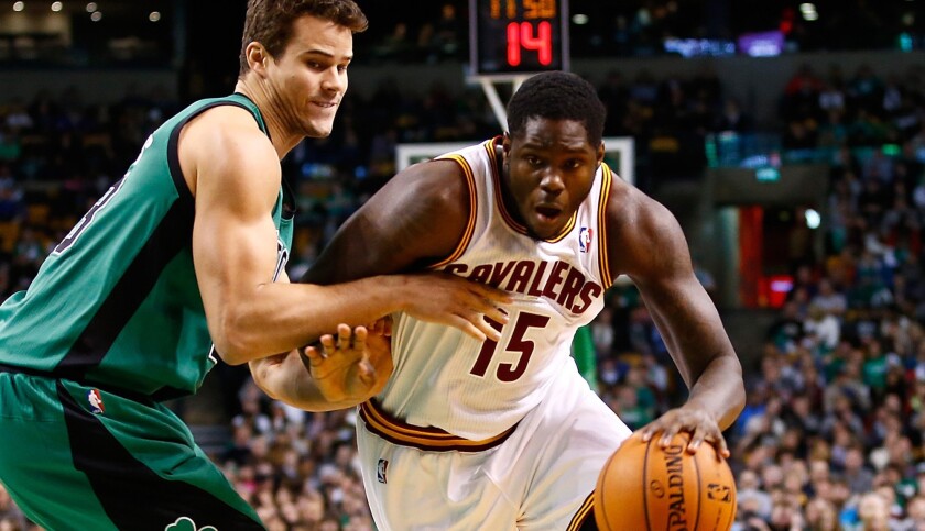 Then-Cavaliers rookie Anthony Bennett drives against Celtics forward Kris Humphries during a game in 2013 in Boston.