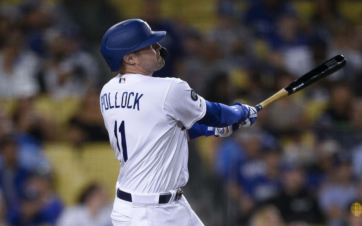 Dodgers left fielder A.J. Pollock hits his third home run of the game.