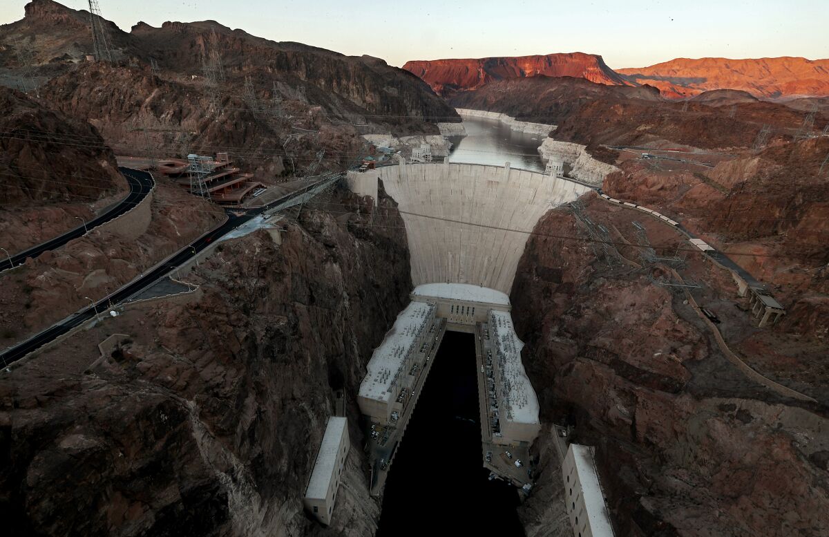 A dam holds back water in a reservoir.