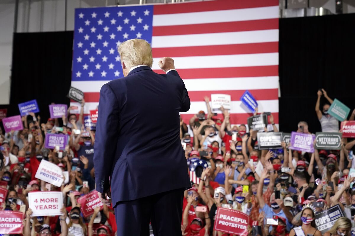 President Trump arrives at a rally in Henderson, Nev., in defiance of a state order against large gatherings.