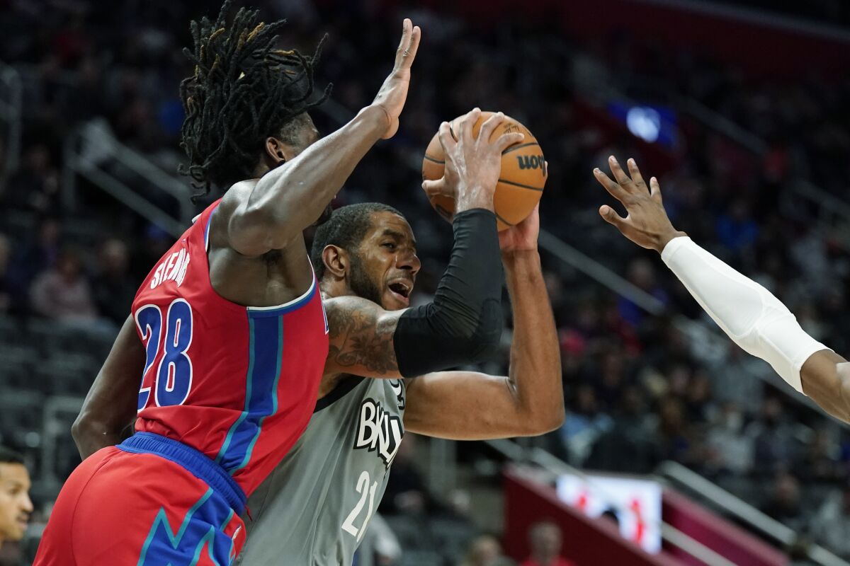 Brooklyn Nets center LaMarcus Aldridge (21) is defended by Detroit Pistons center Isaiah Stewart (28) during the second half of an NBA basketball game, Sunday, Dec. 12, 2021, in Detroit. (AP Photo/Carlos Osorio)