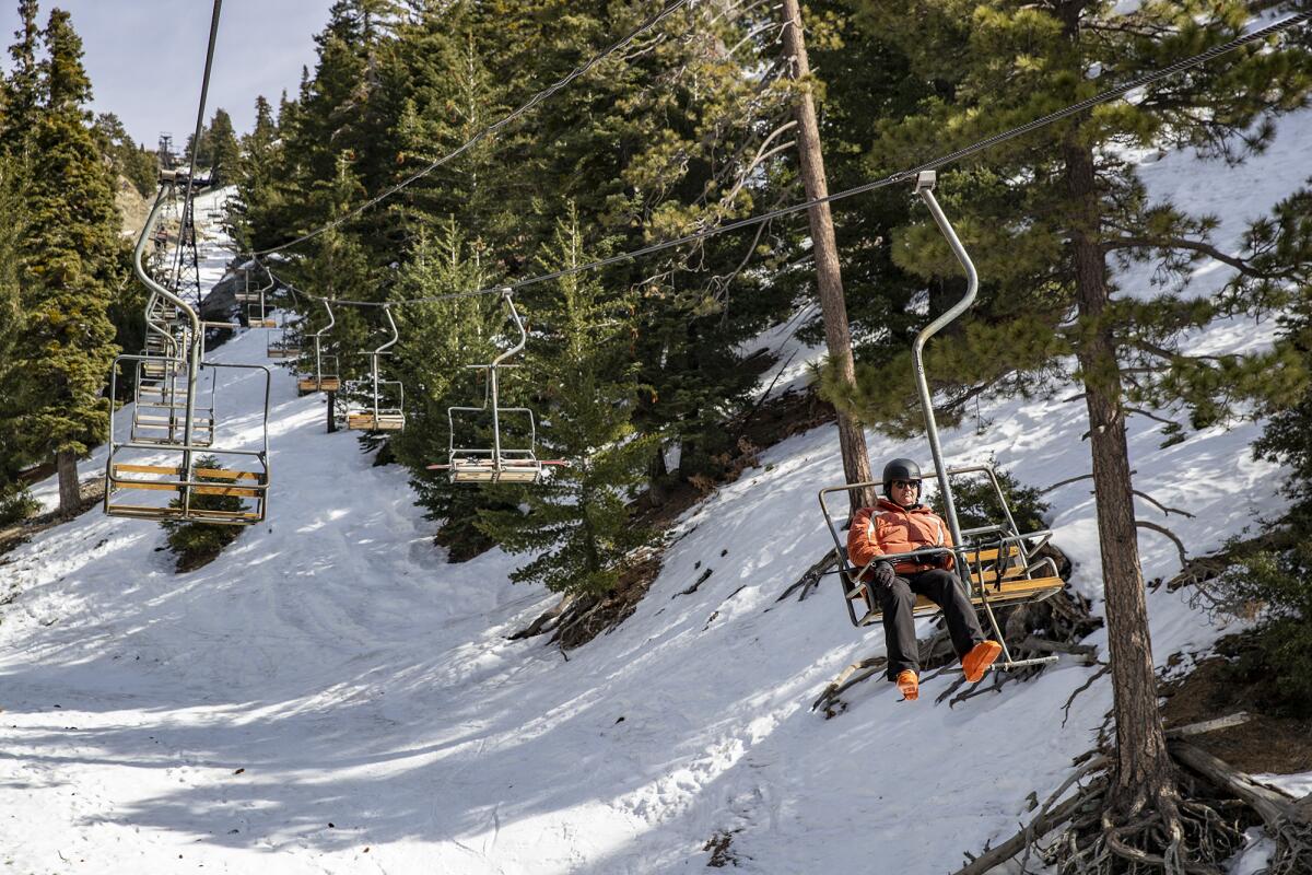 Mt. Baldy is opening today, but with restrictions, including a COVID-19 social distancing plan. Above: A skier rides a lift on Jan. 18, 2020.