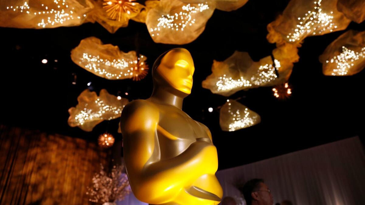 Oscar statue under the ceiling artwork that is featured through the Ray Dolby Ballroom for the 89th Oscars Governors Ball press preview.