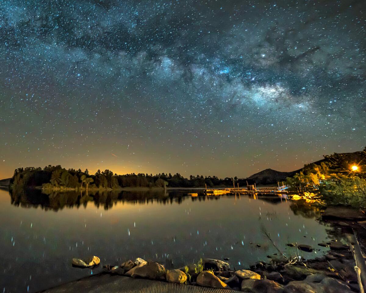 A lake with stars and the Milky Way in the sky