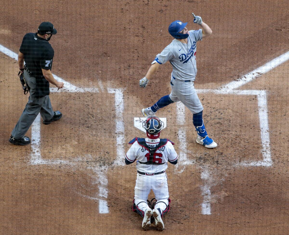 Dodgers left fielder Joc Pederson celebrates as he crosses the plate after hitting a three-run home run.