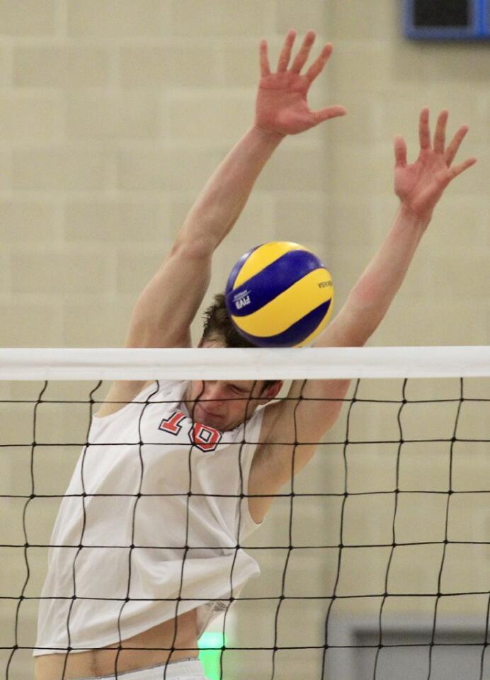 Orange Coast College's Scott Metrakos blocks a shot by Santa Monica in the 2014 California Community College Athletic Assn. State Championship match at Santiago Canyon College in Orange on Friday.
