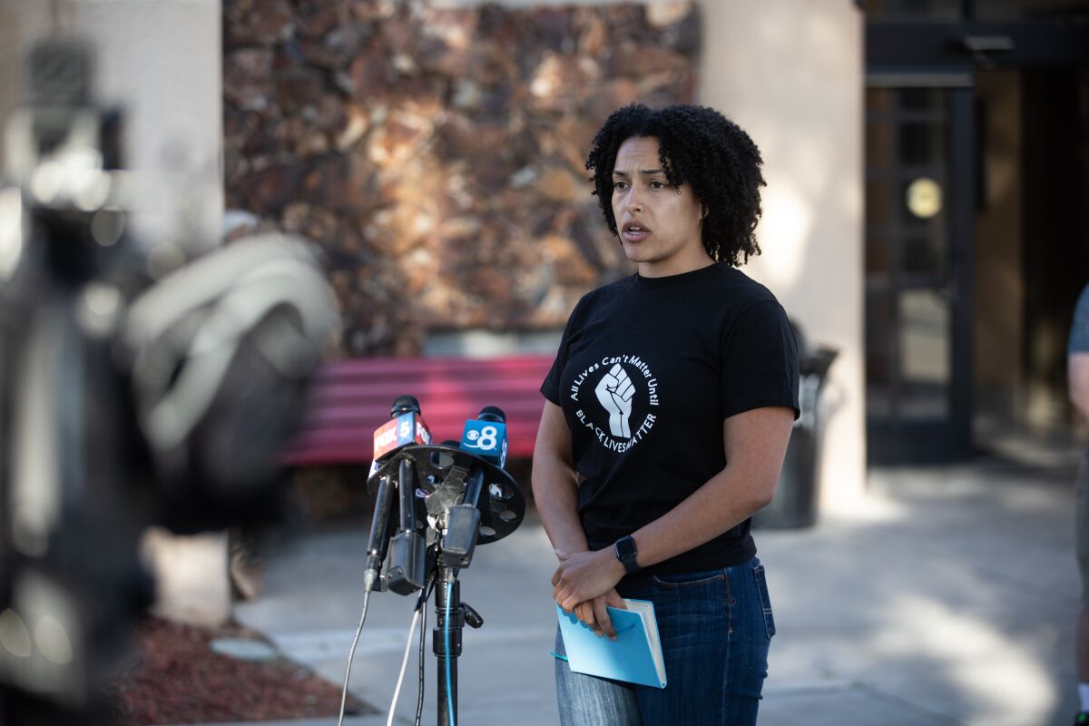Danielle Wilkerson, co-founder of East County BIPOC, speaks to press Tuesday evening before a town hall in Lakeside.