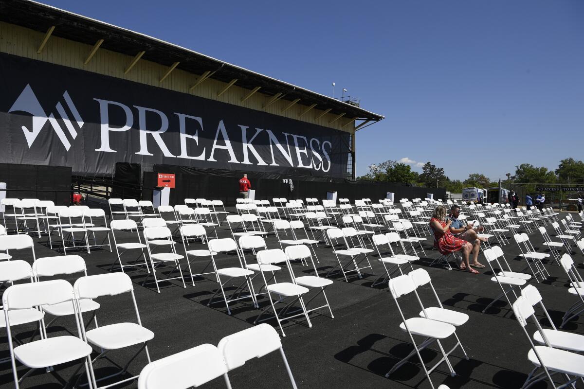 Socially distanced seats are set up at the Preakness Stakes.