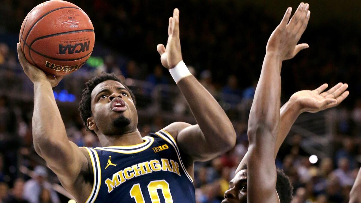Michigan guard Derrick Walton Jr. has been the catalyst for the Wolverines' late-season surge.