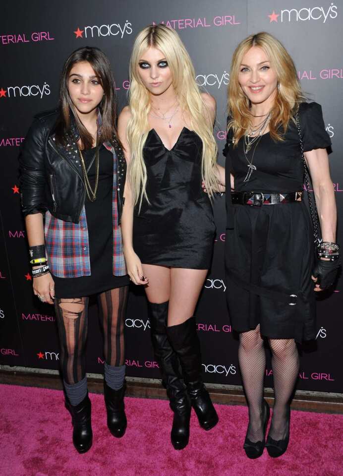 In 2010, Madonna and her daughter, Lourdes "Lola" Ciccone Leon, teamed up with Macy's to launch Material Girl, a 1980s-inspired clothing line for young women that would be available in 200 Macy's stores. "Sometimes [Lourdes] will do certain things or say certain things and I'll feel like I'm looking in a mirror," Madonna said. "I'll get really irritated with her and then I'll stop and think, 'But that's what I used to do.' Or 'That's what I do.' If I complain to my friends and say, 'Oh, she's so strong willed or she's so opinionated,' they look at me and go, 'Well, what did you expect?' " Former "Gossip Girl" actress-turned-punk-rocker Taylor Momsen first fronted the line but was later replaced by Kelly Osbourne. But the sartorial collection came under fire when a Los Angeles apparel manufacturer sued the pop star, claiming they had been selling their merchandise under the same brand name since 1997.