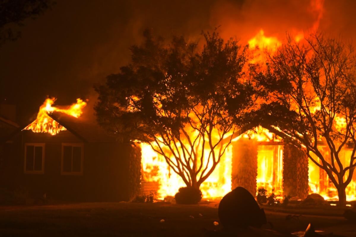 A fire burns a home