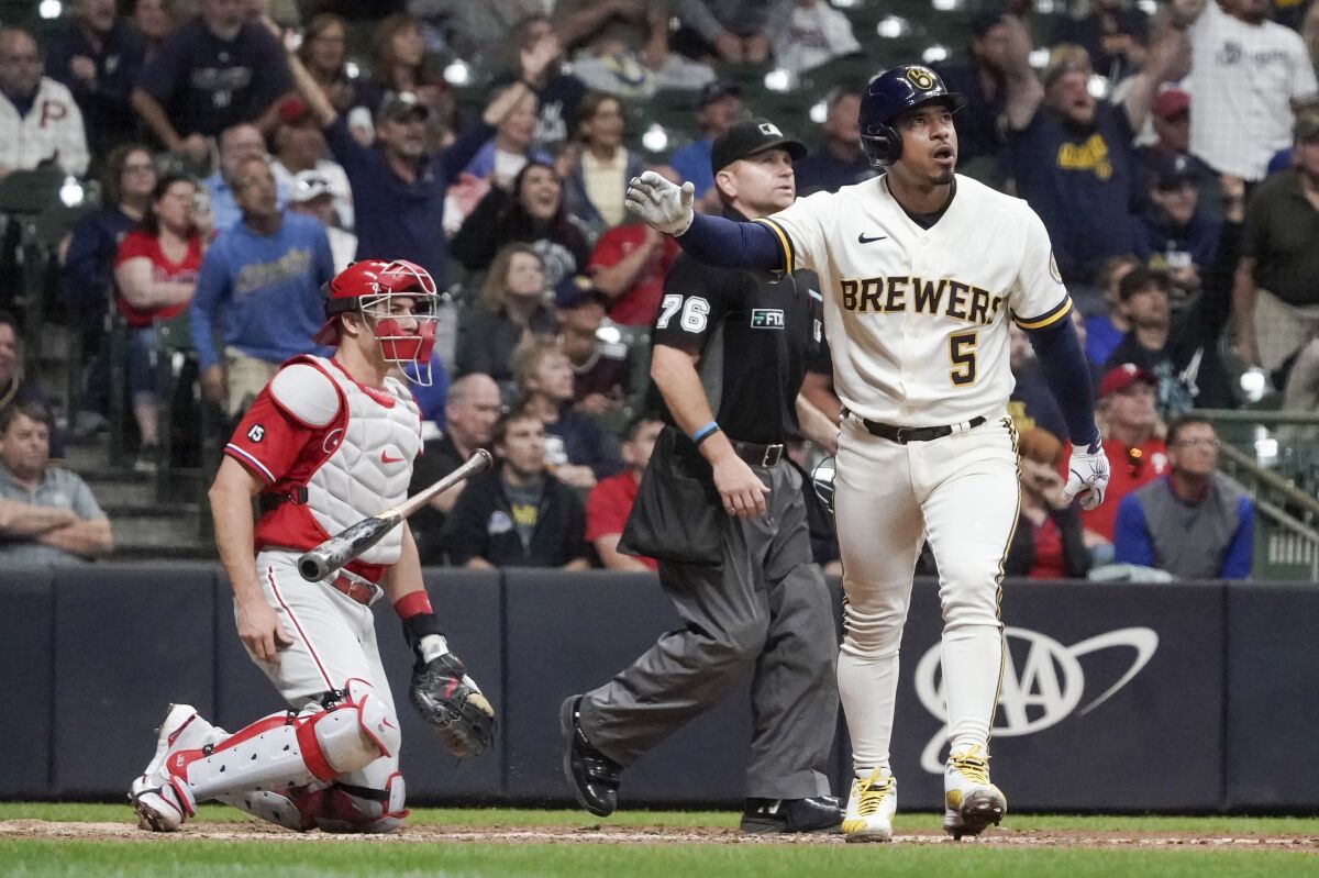 Milwaukee Brewers' Eduardo Escobar hits a home run during the sixth inning of a baseball game against the Philadelphia Phillies Wednesday, Sept. 8, 2021, in Milwaukee. (AP Photo/Morry Gash)