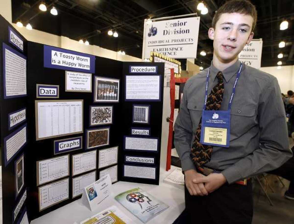 St. Francis High School junior Christopher Sercel, 17, talks about his findings on how heat affects mealworm activity at the Los Angeles County Science Fair held at the Pasadena Convention Center. More than 1,000 middle- and high school students participated in this event.