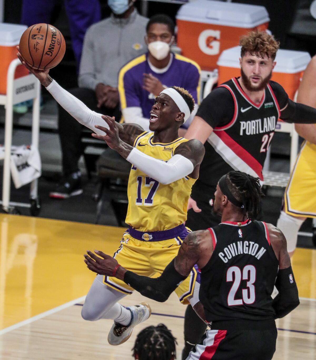 Dennis Schroder slices past Robert Covington for a second-half layup Monday. 