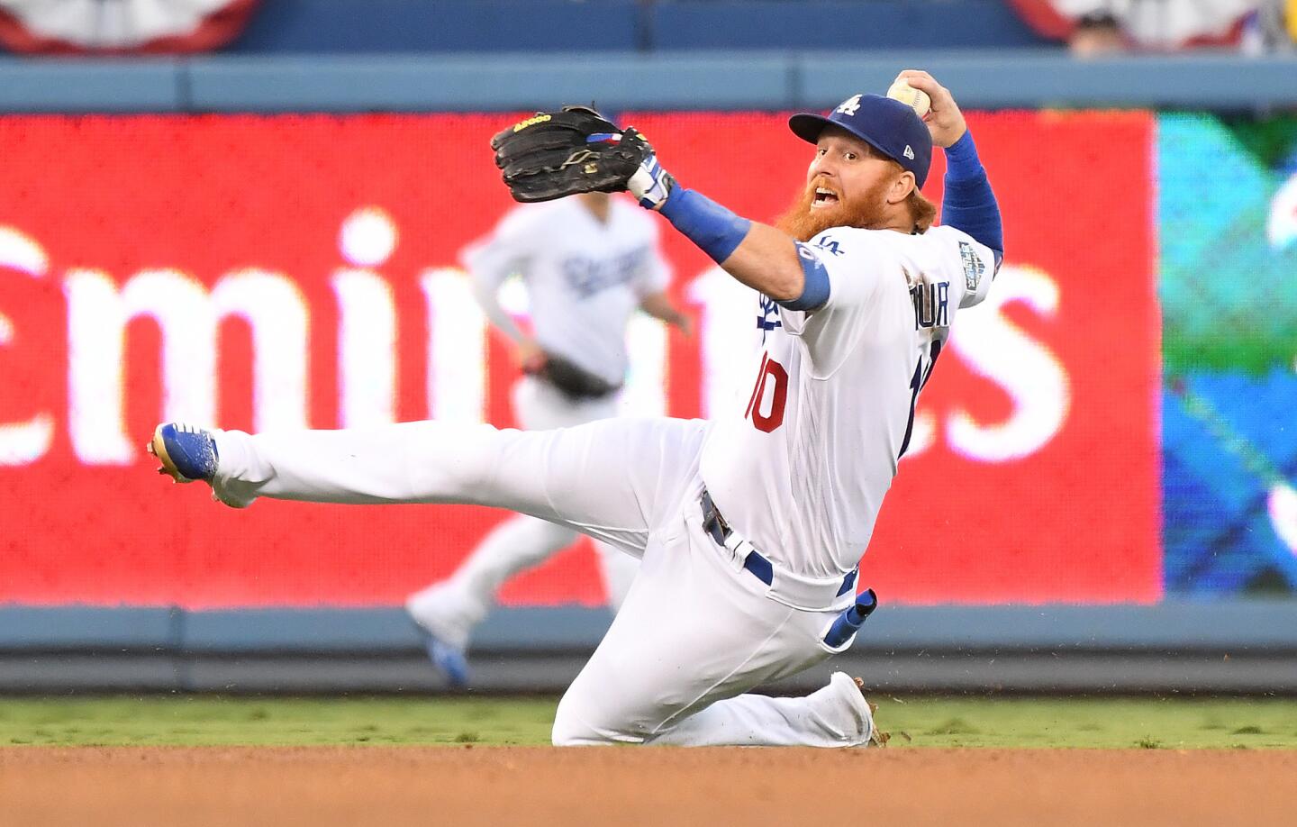 Dodgers Justin Turner fields the ball but can't throw out Red Sox hitter Jackie Bradley Jr. in the 3rd inning.