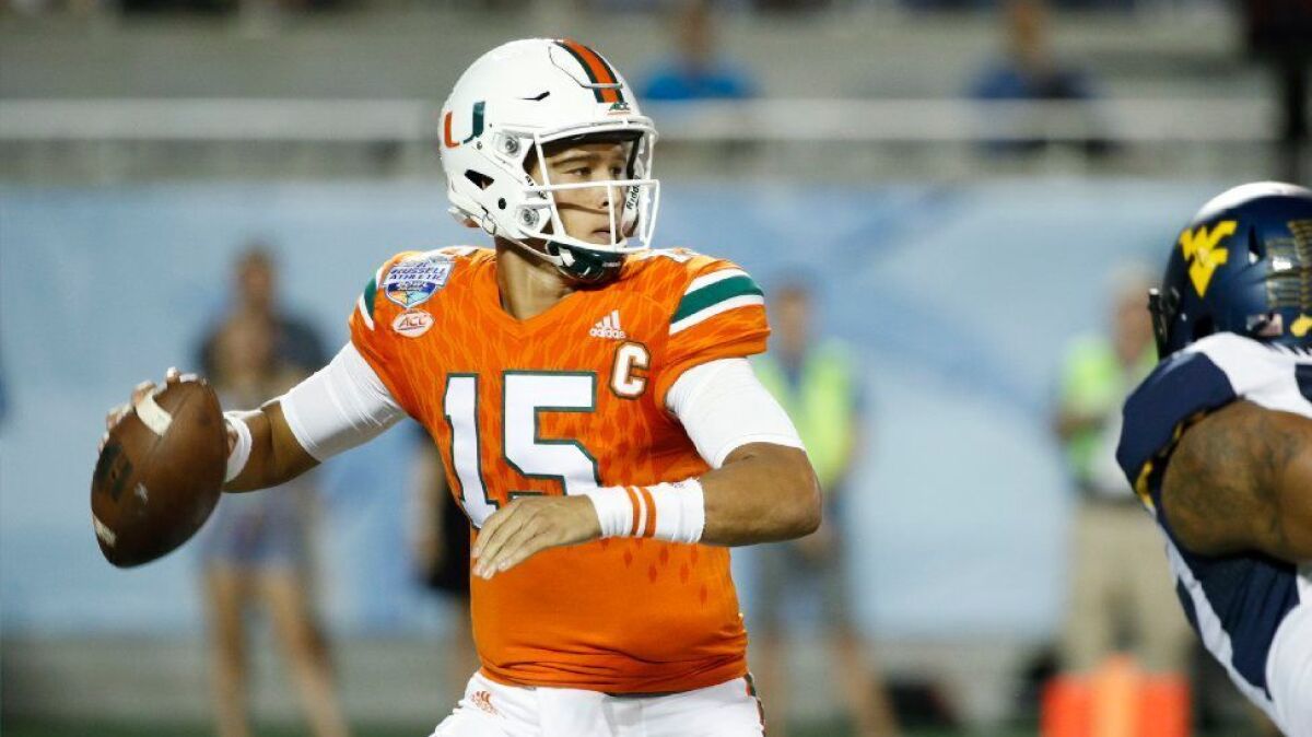 Miami quarterback Brad Kaaya, who went to Chaminade, looks to throw against West Virginia during a game on Dec. 28.