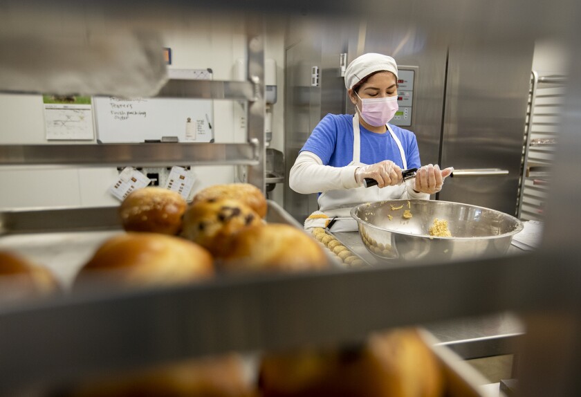 Jennifer De La Cruz bakes pecans at the kosher Jewish bakery, the Blessed Braid in Irvine.