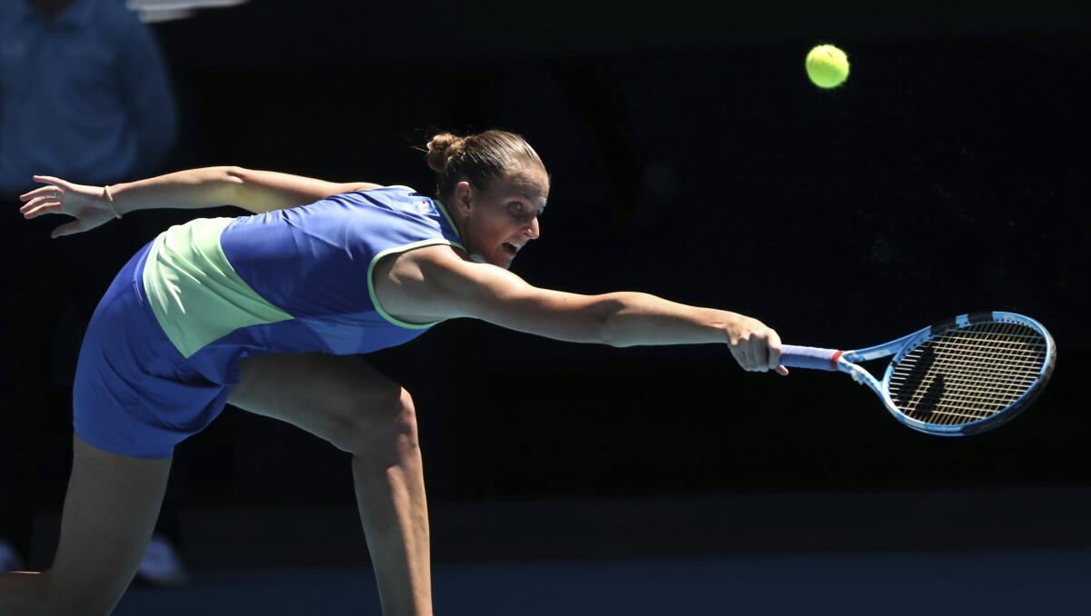 Karolina Pliskova of the Czech Republic makes a return hit to Anastasia Pavlyuchenkova of Russia during their third round match Jan. 25 at the Australian Open.