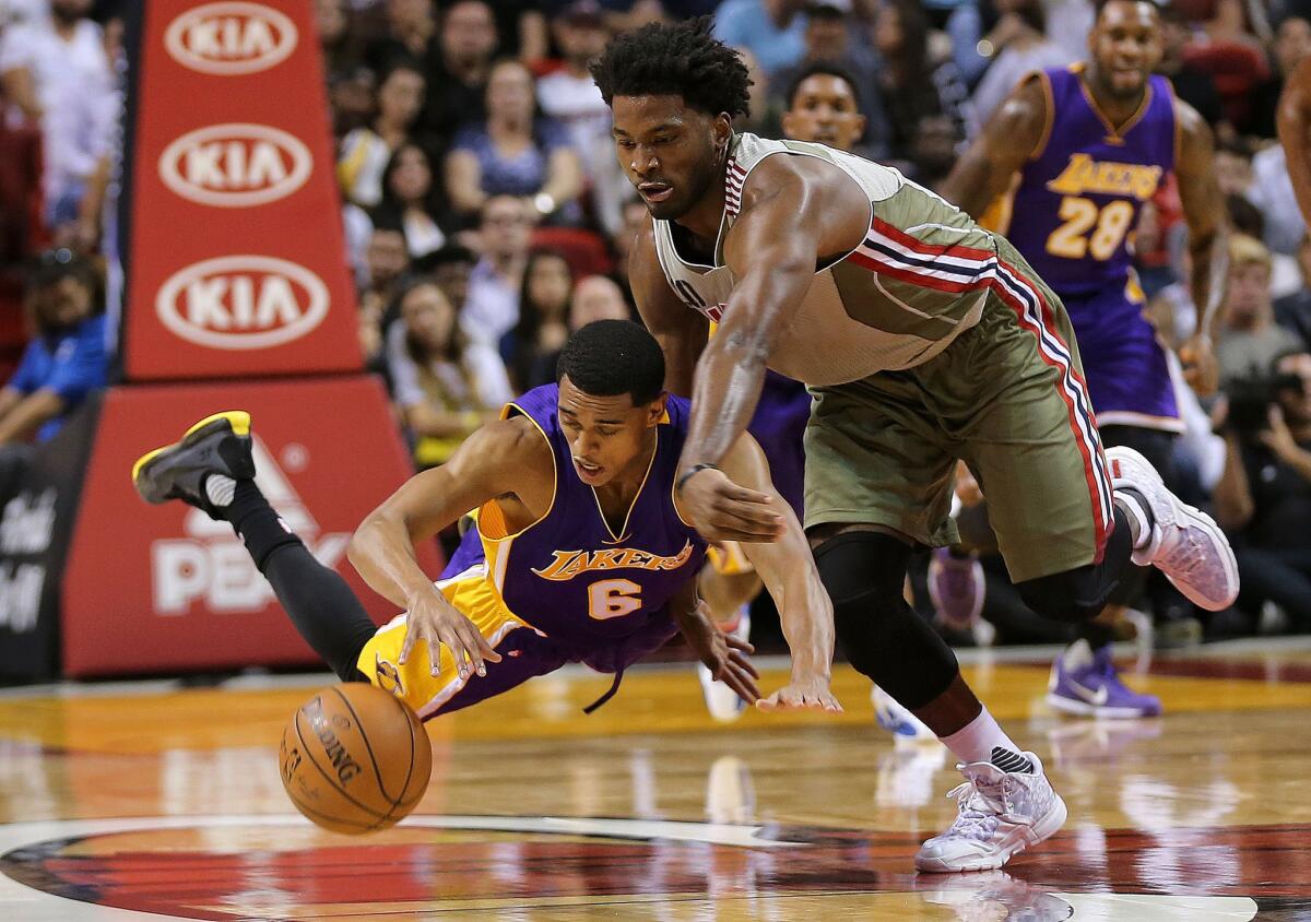 Lakers guard Jordan Clarkson and Heat rookie forward Justise Winslow chase a loose ball during a game Nov. 10 at AmericanAirlines Arena.