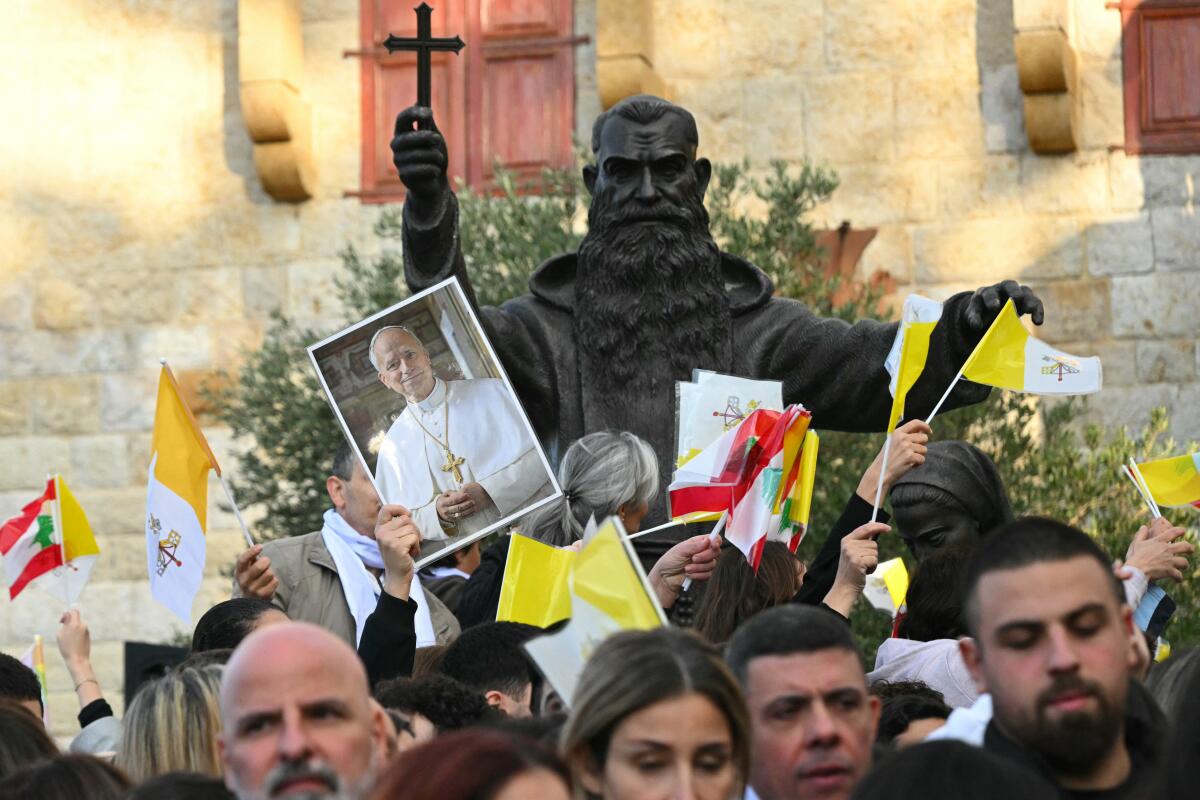 People gather outside the Sisters of the Cross Hospital