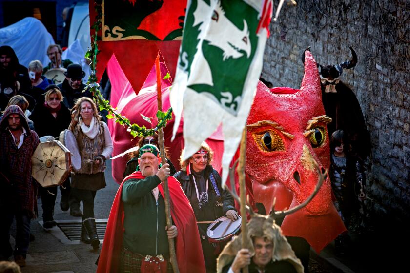 The Glastonbury Dragons are paraded through the town as they celebrate Samhain at the Glastonbury Dragons Samhain Wild Hunt
