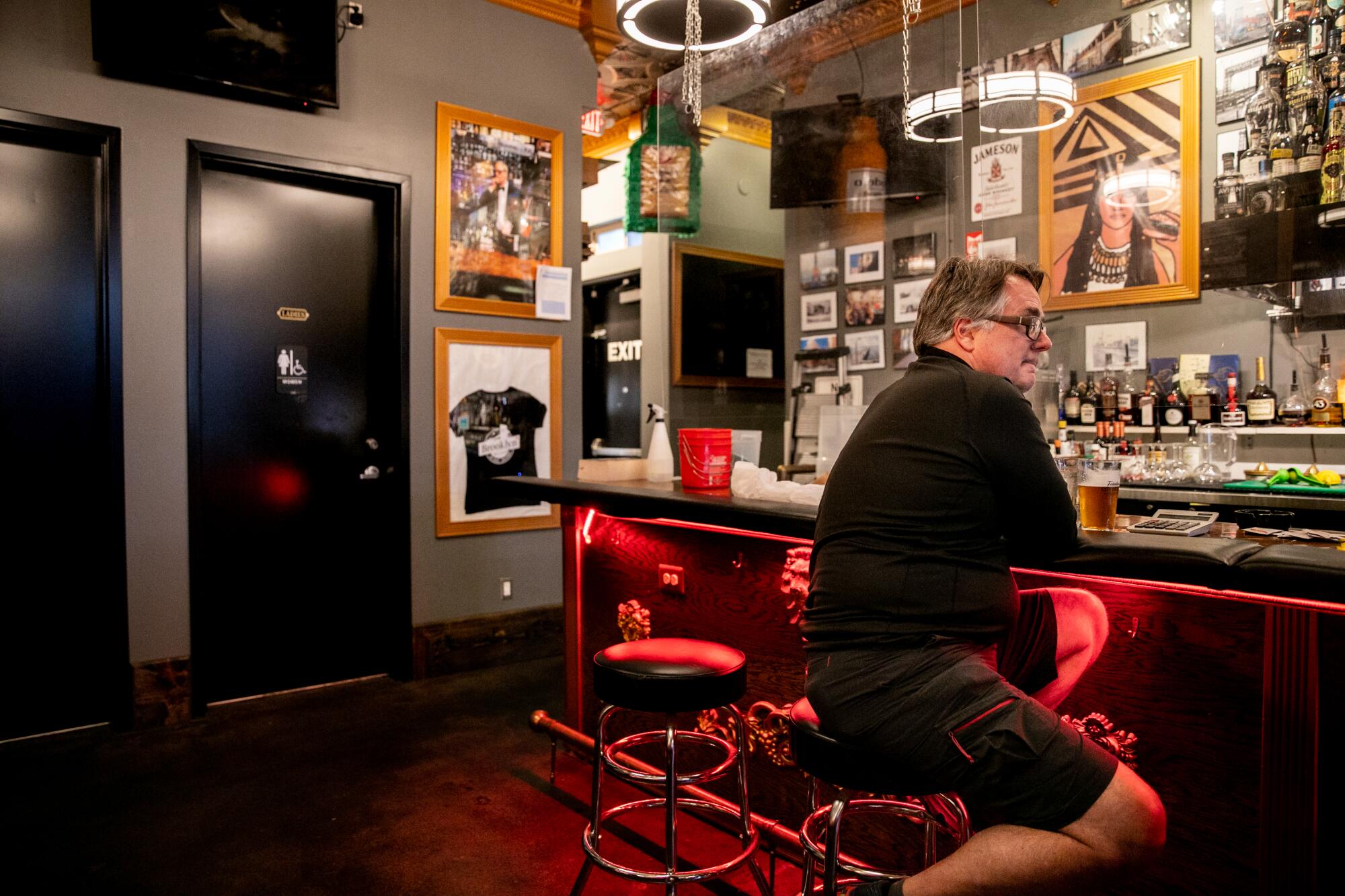 John Lutzius shares memories of his brother Bill Lutzius while posted up a the bar on Monday.