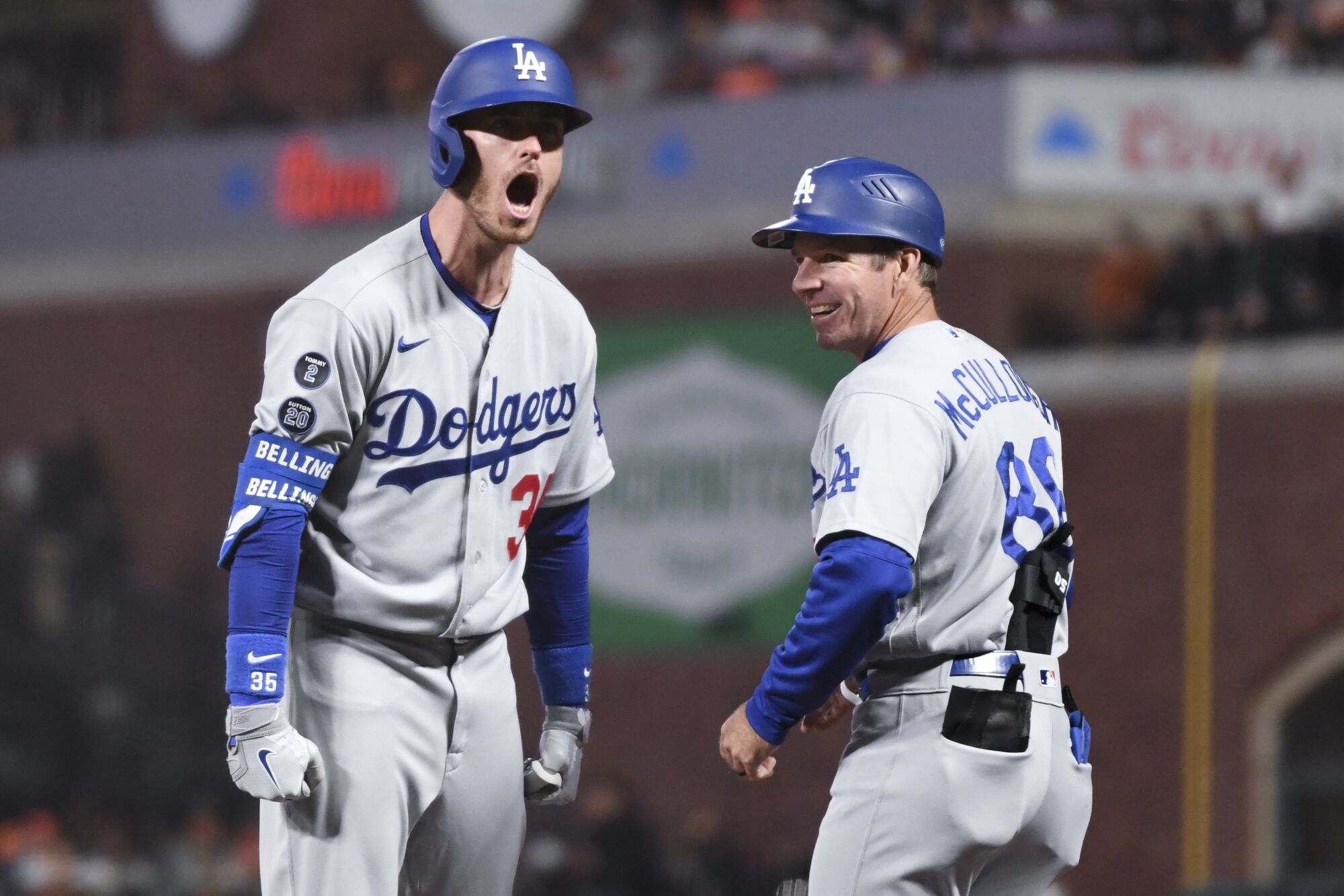 Dodgers' Cody Bellinger yells to the dugout after hitting a single against the Giants on Oct. 14, 2021, in San Francisco.