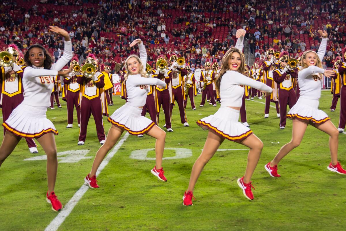 USC song girls Josie Bullen (far right) and Adrianna Robakowski (second from right) perform during a Trojans football game.