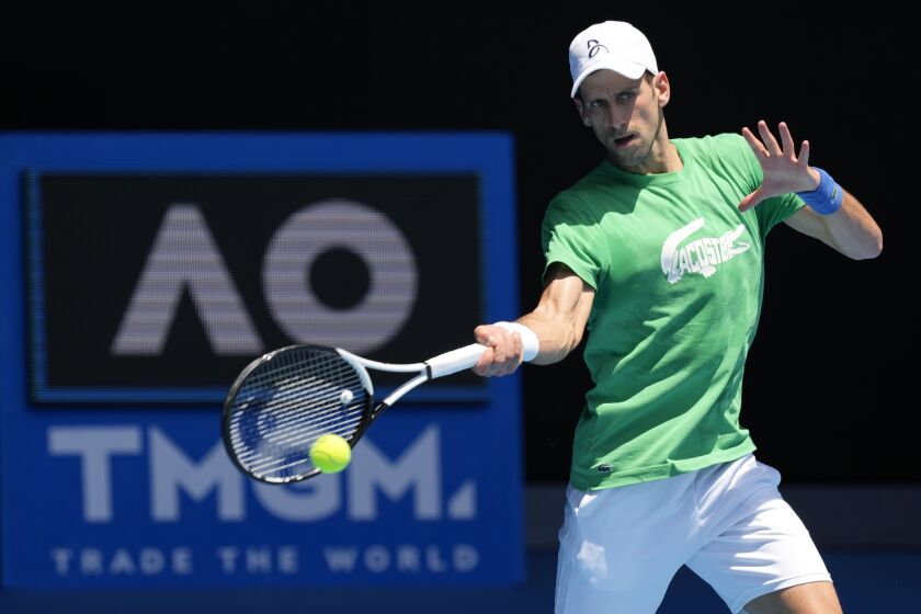 FILE - Defending men's champion Serbia's Novak Djokovic practices on Margaret Court Arena.