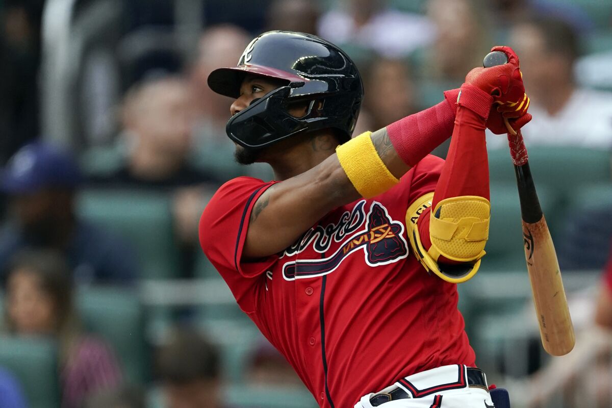 Atlanta Braves' Ronald Acuna Jr. watches his double during the first inning of the team's baseball game against the Pittsburgh Pirates on Friday, June 10, 2022, in Atlanta. (AP Photo/John Bazemore)