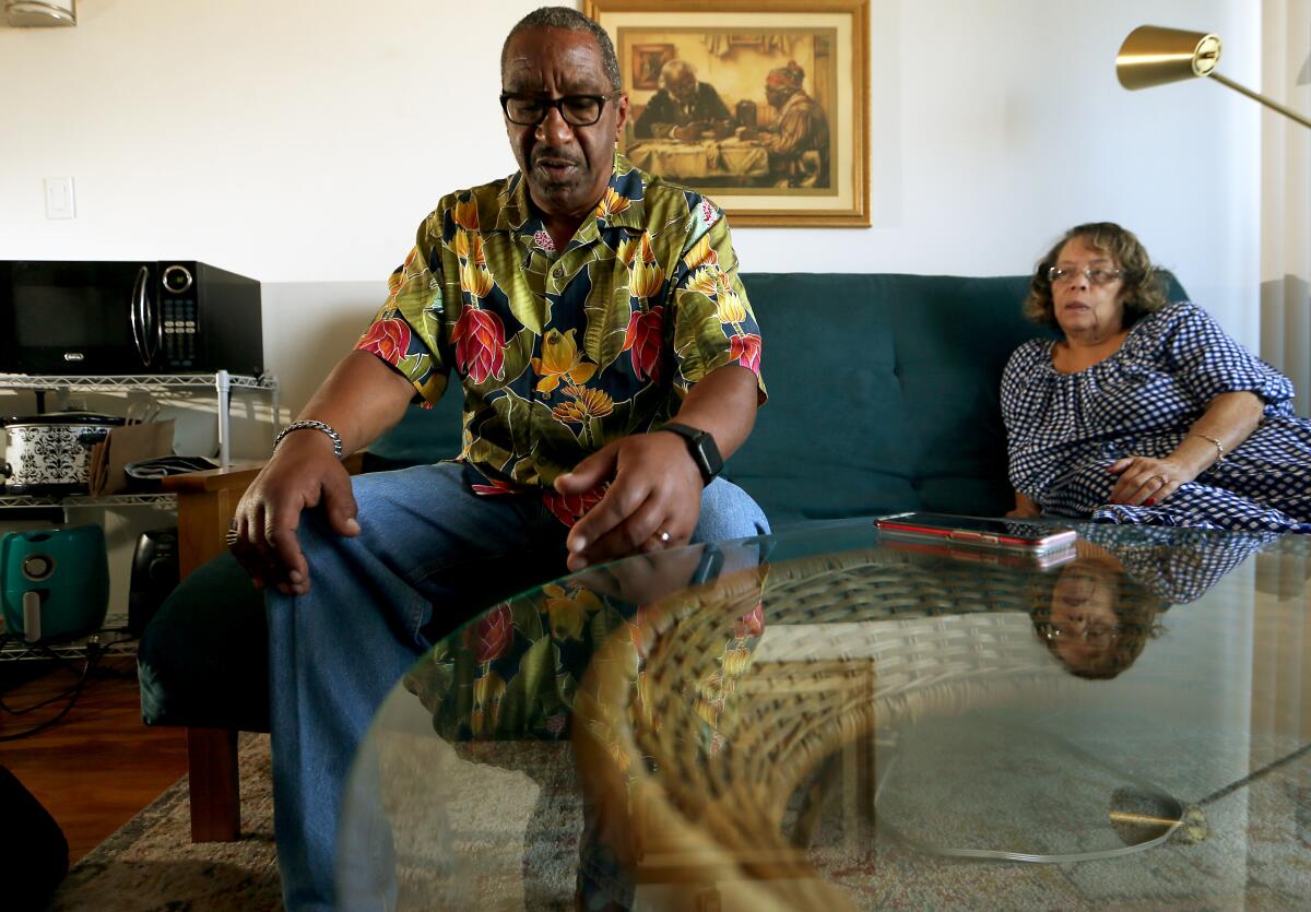 David Moreland, 67, recounts his bout with COVID in prison as his wife, Sherry, listens at home in Long Beach.