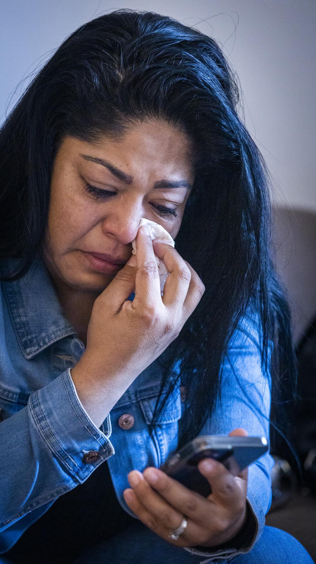 Cristian Mendoza weeps while talking about the life of her brother, Alan Castellanos, who was fatally shot by the LAPD