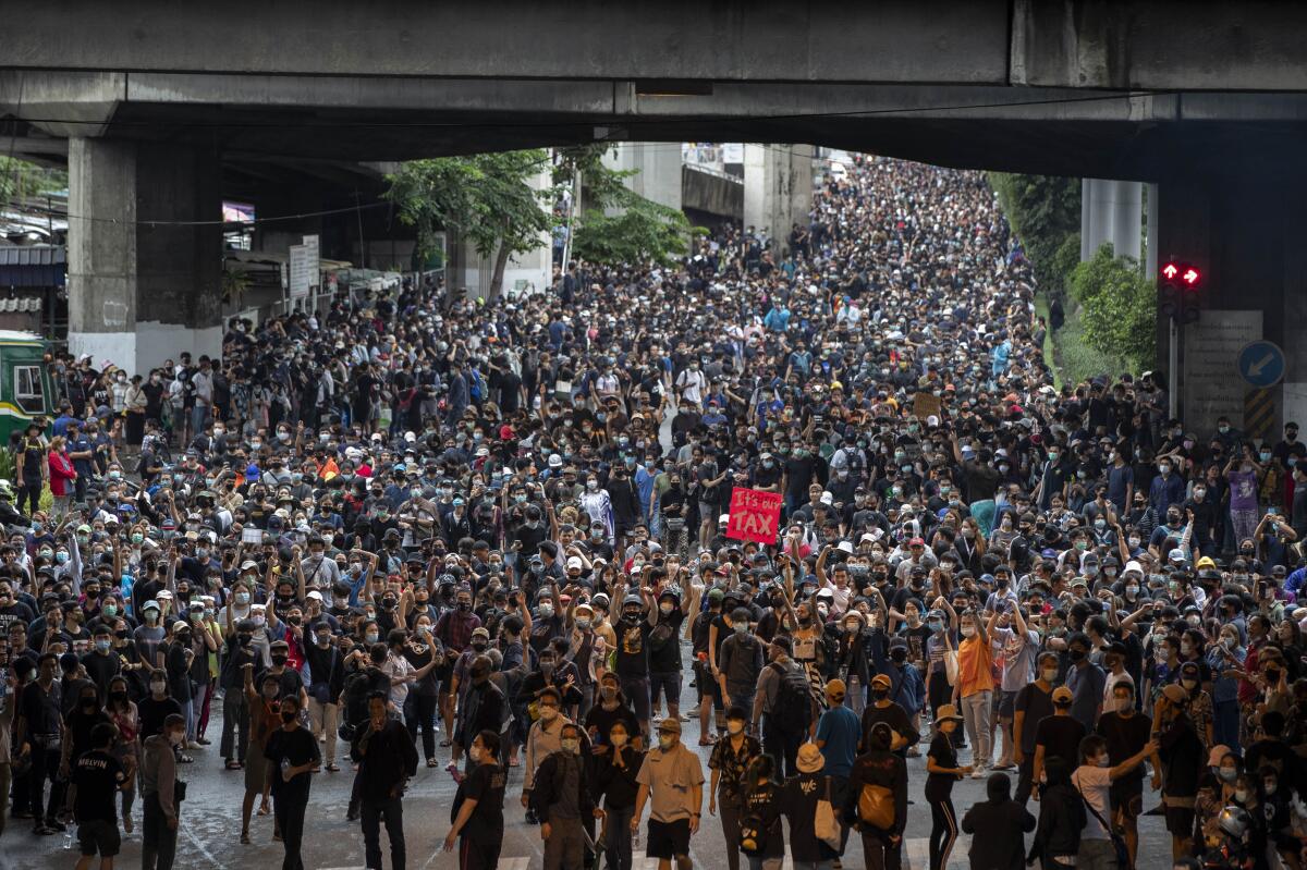 Pro-democracy protesters march during a protest in Udom Suk, suburbs of Bangkok, Thailand