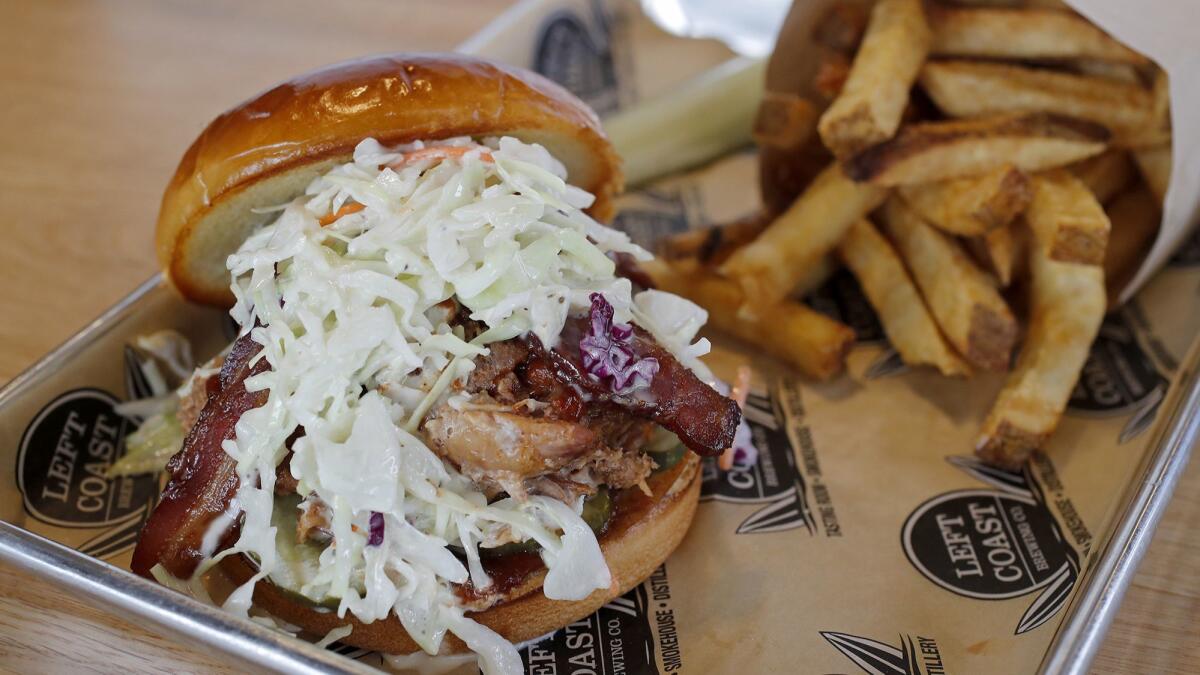 A smoked pulled pork sandwich at the new Left Coast Brewery tasting facility in Irvine.