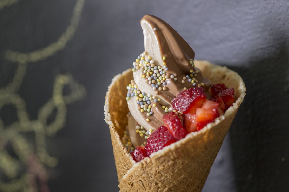 Yoga-Urt offers a soft-serve vegan and gluten-free chocolate, vanilla swirl on vegan homemade waffle cone.