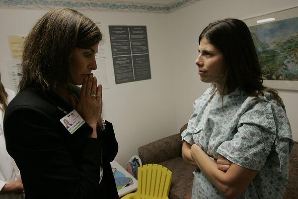Anna Gorman, right, with Dr. Beth Karlan before surgery at Cedars-Sinai Medical Center in 2006.