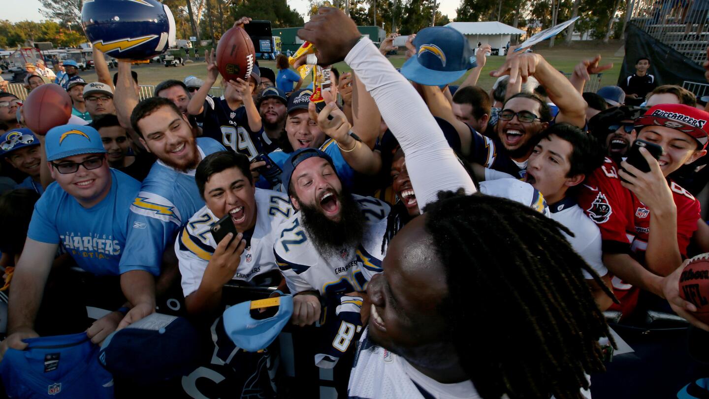 Chargers defensive end Melvin Ingram mingles with fans following the joint practice.