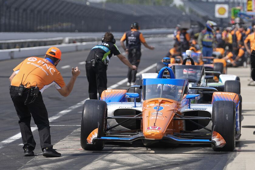 Scott Dixon, of New Zealand, leaves the pits during practice for the Indianapolis 500.