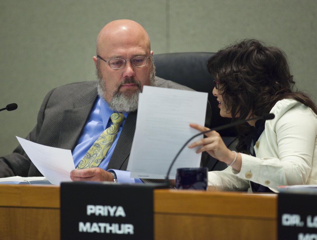 Rob Feckner, president of the CalPERS board of administration, and board member Priya Mathur.