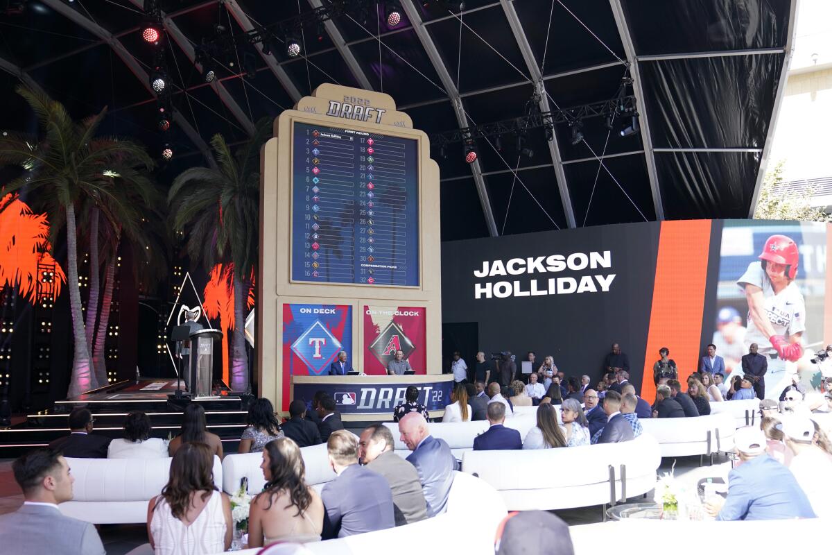 Jackson Holliday is announced as the first pick of the 2022 MLB baseball draft, by the Baltimore Orioles, Sunday, July 17, 2022, in Los Angeles. (AP Photo/Abbie Parr)