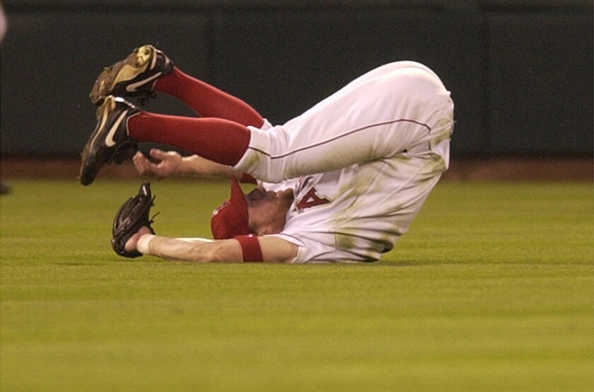 Darin Erstad makes a tumbling catch during Game 7 of the 2002 World Series against the Giants.