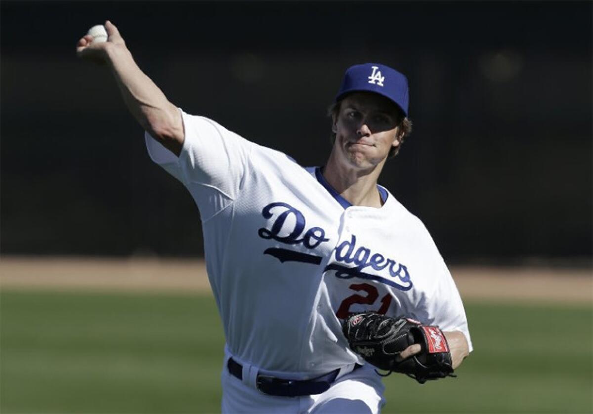 Dodgers starting pitcher Zack Greinke throws during spring training.