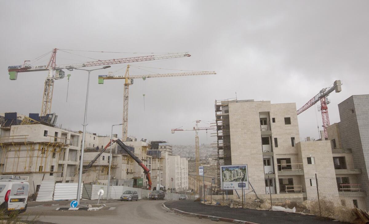 Construction in the Har Homa settlement near the Palestinian East Jerusalem neighborhood of Sur Baher, on Dec. 27. The Jerusalem municipality postponed a vote on 618 new houses in East Jerusalem settlements.